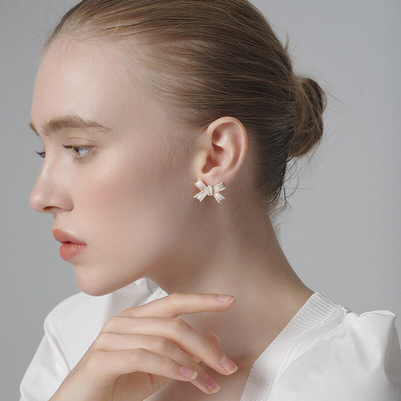 Bow earrings with pearl and chain drop design d925 doop